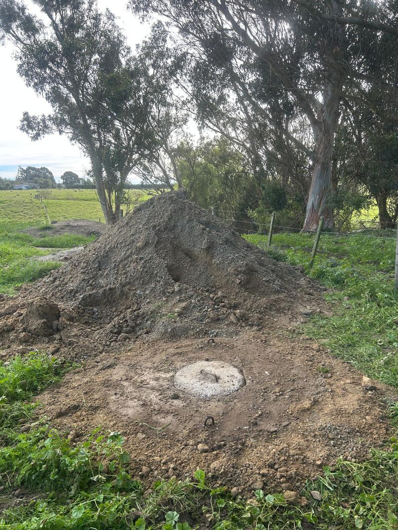 Completed pit with treated timber lid